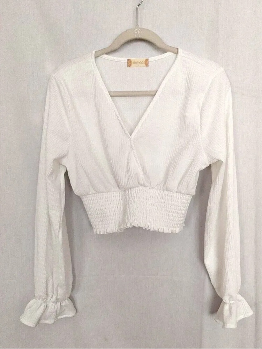 Super cute white long sleeve from Altar'd State. Perfect for nights out.